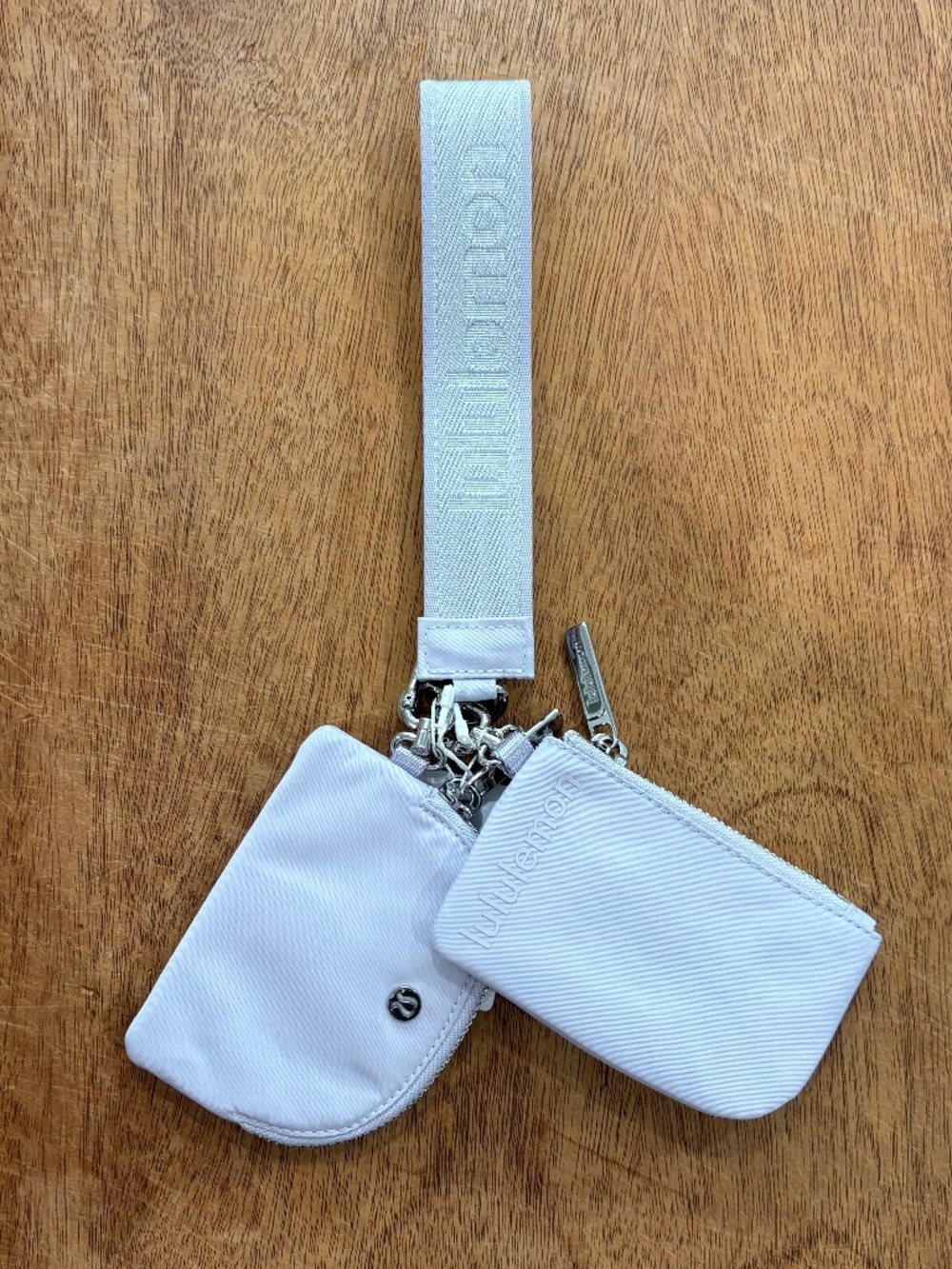 Lululemon dual pouch wristlet metallic wordmark faint lavender
